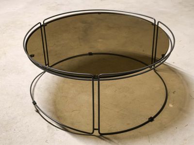 an image of a round coffee table with a mirror on top