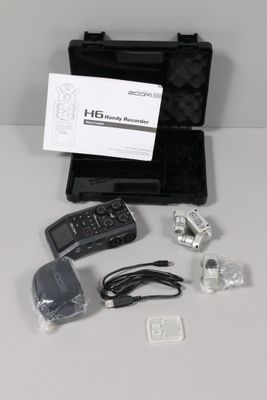 a black case with a remote control and other items