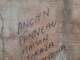 a piece of wood that has writing on it