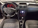 a dashboard of a car with a steering wheel and a dash board