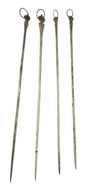 three old metal tools are sitting next to each other