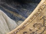 a picture of a painting of a woman in a gold frame