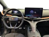 the interior of a car with a laptop on the dashboard