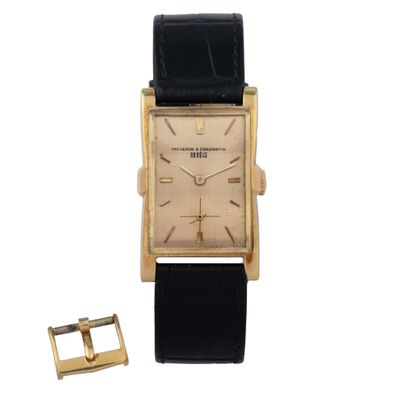 a close up of a watch with a buckle on a white background