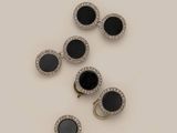 three pairs of black and white diamond earrings and a pair of black and white diamond earrings
