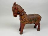 a small wooden horse with a bridle on it ' s head