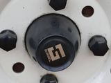 a close up view of a truck wheel with a logo on it
