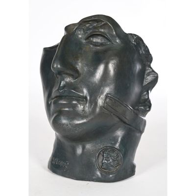 an image of a bronze head sculpture of a man with his eyes closed