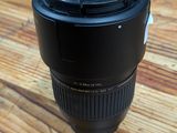 a camera lens sitting on top of a wooden table