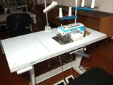 a sewing machine sitting on a table in a room