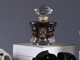 several different types of perfumes are displayed on a white table