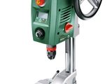 a close up of a drill on a stand with a wheel