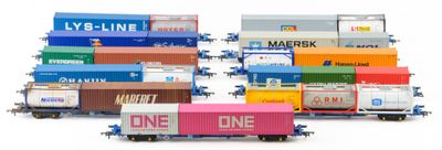 a lot of train cars that are lined up on the tracks