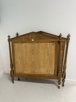 a bed with a wooden headboard and a wooden foot board