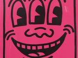pink and black drawing of a smiling face on a pink background