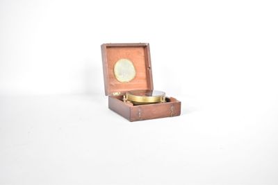 a small wooden box with a coin inside of it