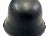 a black helmet that is sitting on a white surface