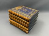 three books stacked on top of each other on a table