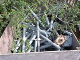a box full of metal pipes and wires in the woods