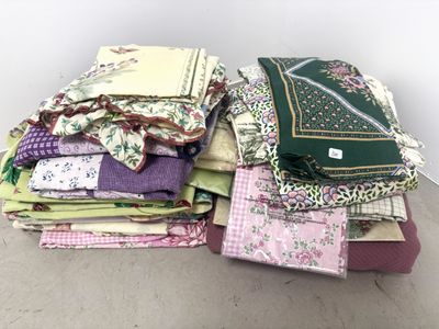 several pieces of fabric stacked on top of each other on a table