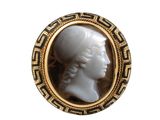 an image of a picture of a woman ' s head in a gold frame
