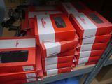 several red boxes are stacked on top of each other on a shelf