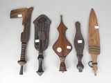 several different types of wooden tools are displayed on a white surface
