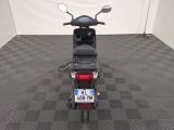 a scooter that is parked in a room