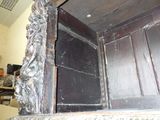 a wooden door that has a carved design on it