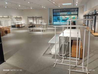 an image of a store with a lot of clothes on display
