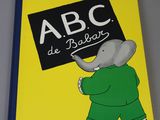 an image of a book with a picture of an elephant holding a sign