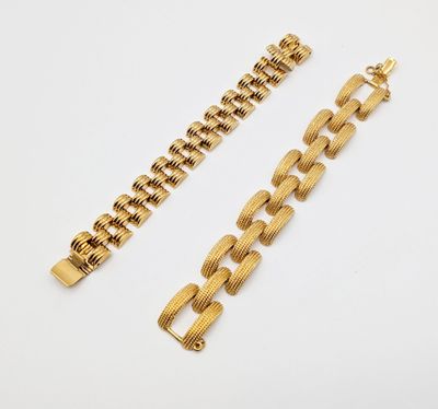 a gold chain bracelet and a gold chain bracelet