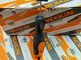 a stack of boxes with a pair of scissors on top of them