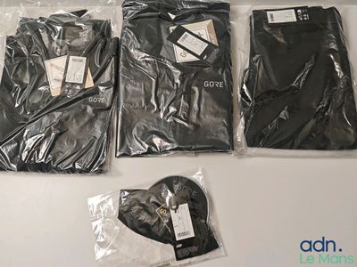 three pairs of men ' s black pants and a pair of men ' s black pants