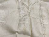 a close up of a white and blue towel with a blue stripe on it