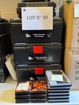 a lot of cds stacked on top of each other on a table