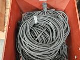 two boxes with wires in them sitting on the ground