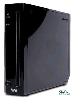a black wii game system with a controller on it