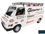 a toy van that is sitting on a white surface