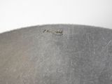 a large metal bowl sitting on top of a table