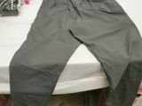 a pair of pants sitting on a bed in a room