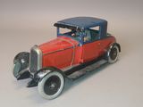 a toy model of a red car with a blue top