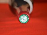 a close up of a starbucks coffee bottle on a table