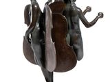 bronze sculpture of three women playing a musical instrument on a pedestal