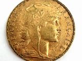 l'image d'une pièce d'or sur laquelle figure une tête de femme