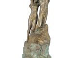statue of a man and a woman embracing on a rock