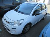 a picture of a small white car parked in a parking lot