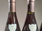 three bottles of wine that are sitting on a table