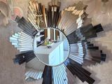 a mirror hanging on the wall in a bathroom