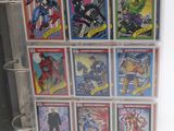 a binder with a bunch of comics on it